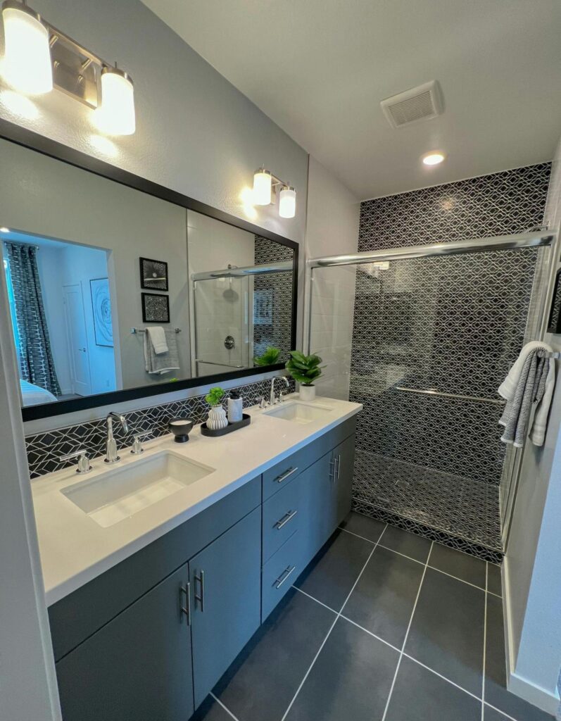 a newly renovated bathroom for the elderly with a safe walk-in shower feature and a grab bar