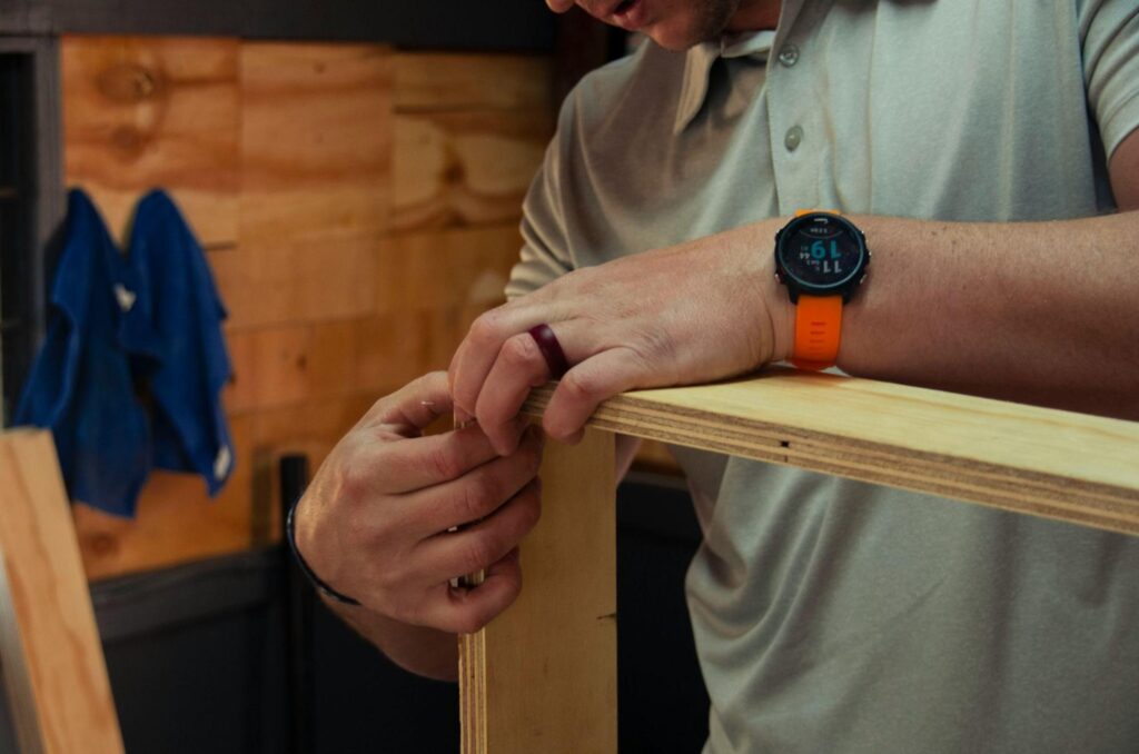 A man assembling a wooden joint