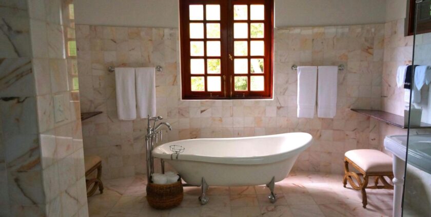 Modern bathroom with window and a bathtub.