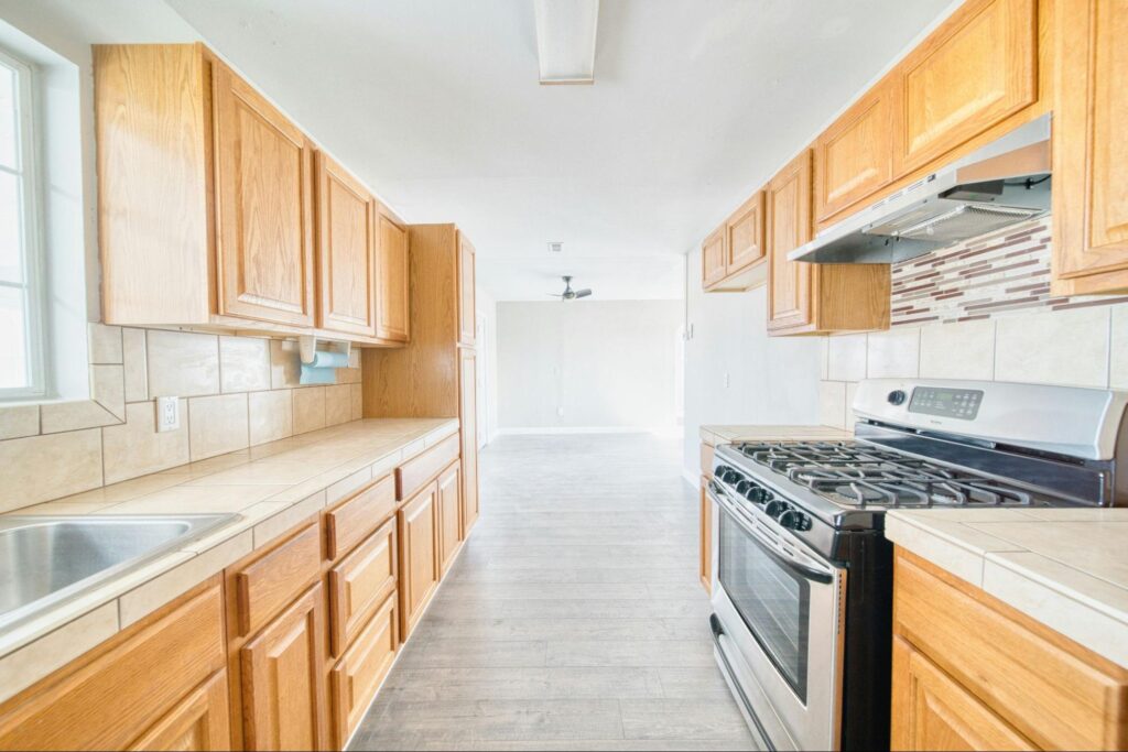 Small galley kitchen with wooden cabinets