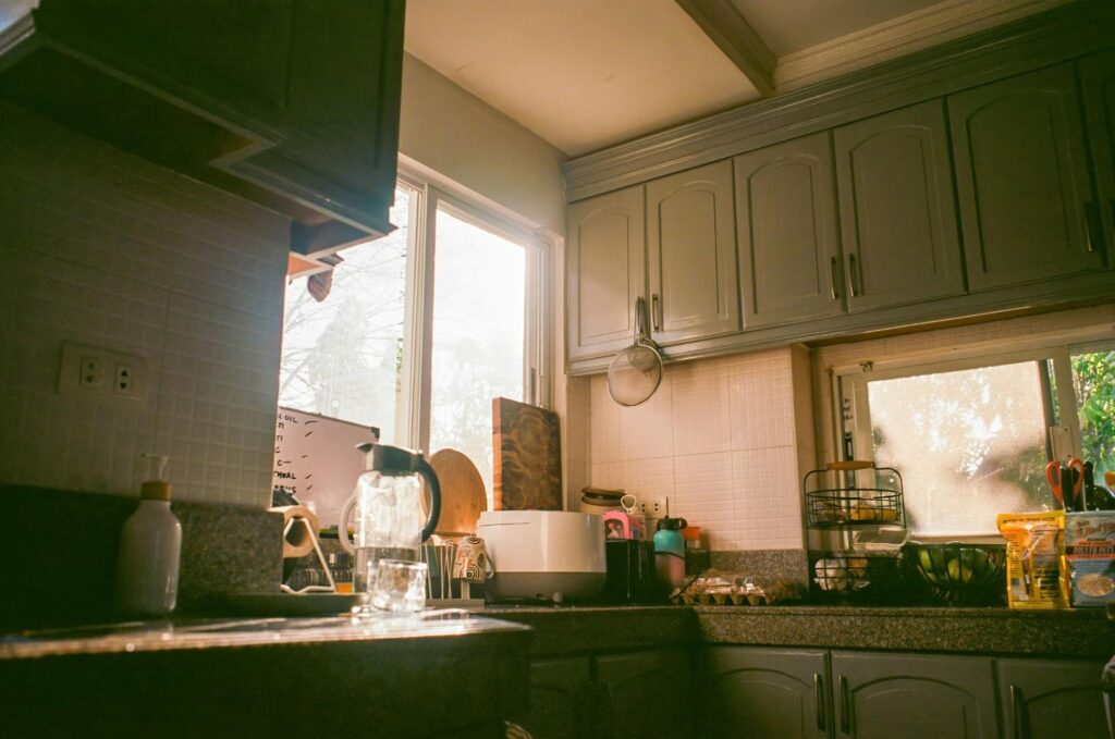 Cozy kitchen with green cabinets