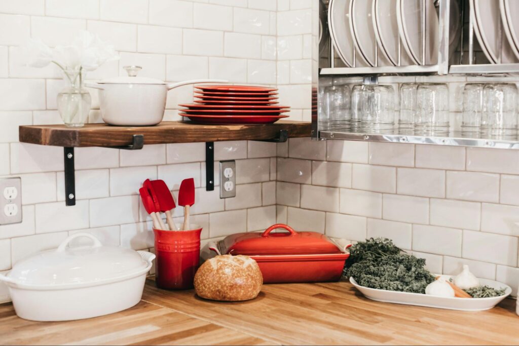 Counterspace with open shelving and cooking utencils