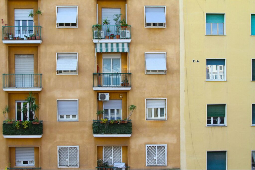 Yellow apartment building with terraces