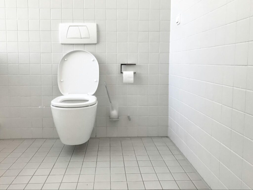 Toilet in an all white bathroom