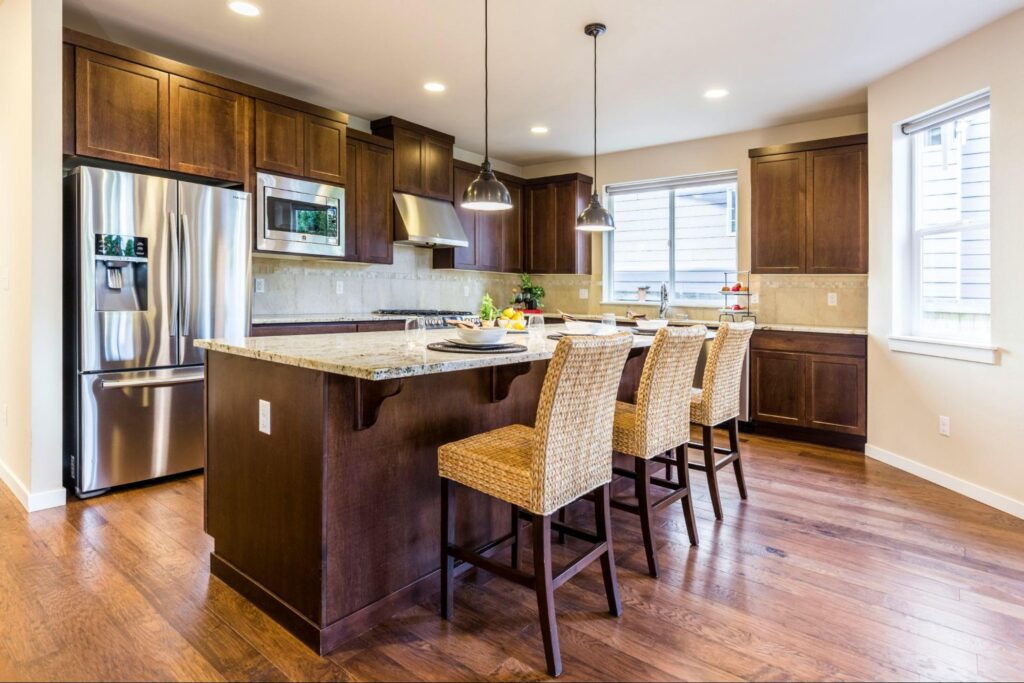 Modern kitchen design with an island and chairs