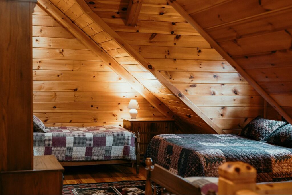 A loft space bedroom with two beds