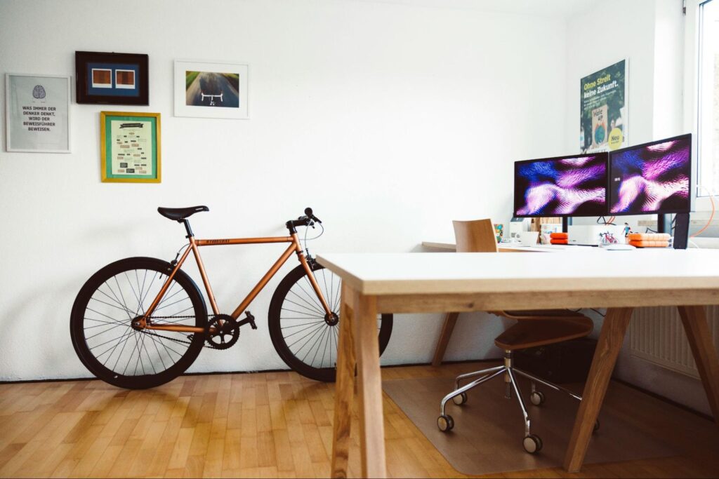 A minimalistic office space with a bicycle parked