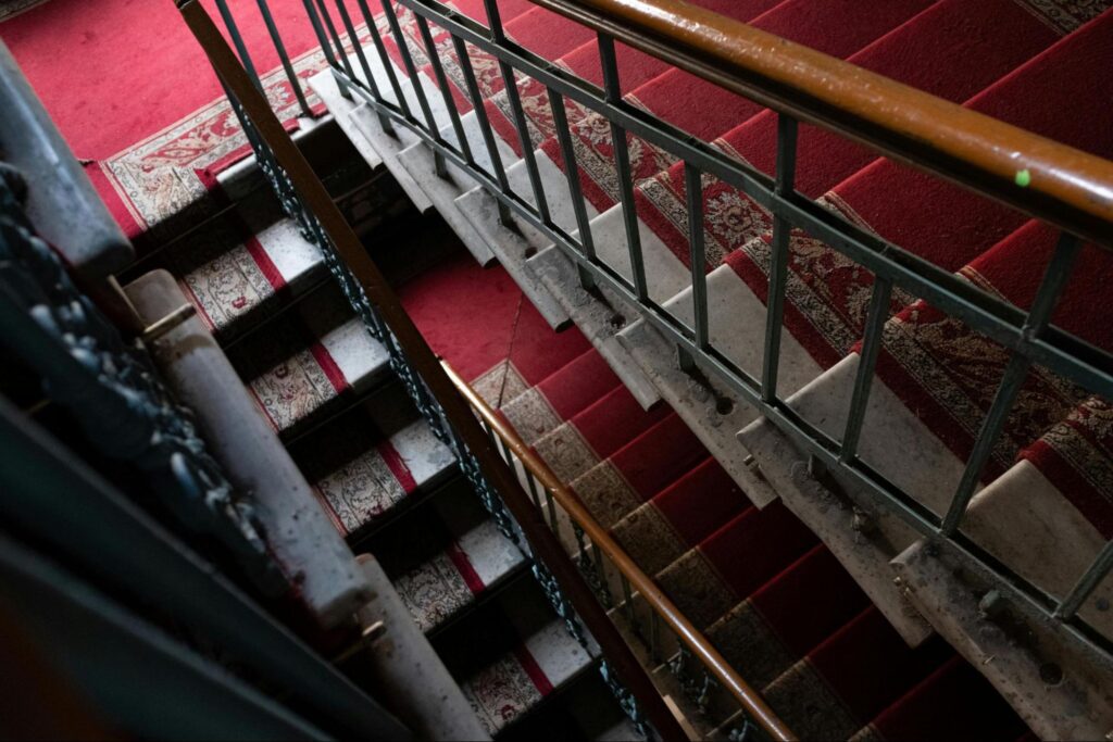 Stairs with a red carpet on them