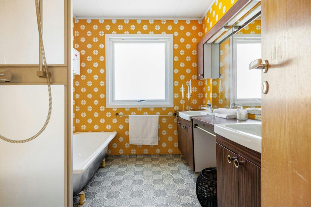 Small bathroom with painted yellow tiles