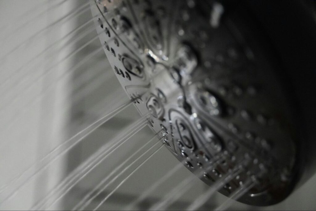 Working shower head with water coming from it
